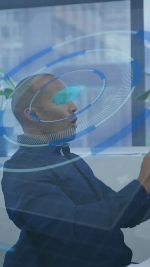 Vertical video: Man picking headset and fitting it activating HUD growing with Stock Footage 343955045