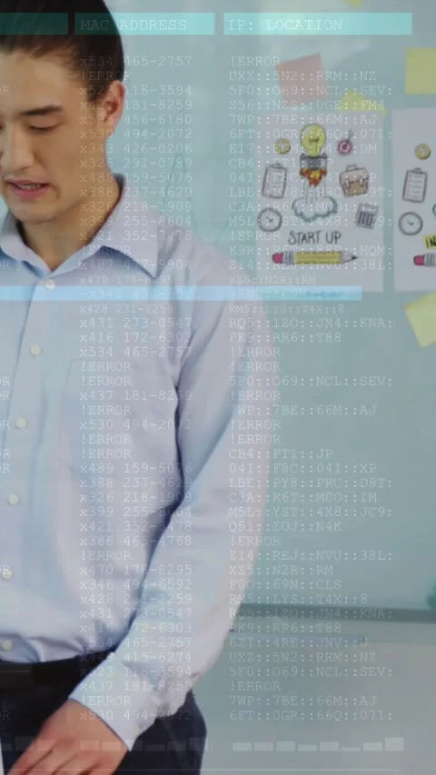 Vertical video: Man placing hands on laptop initiating code overlay obscuring Stock Footage 329841127