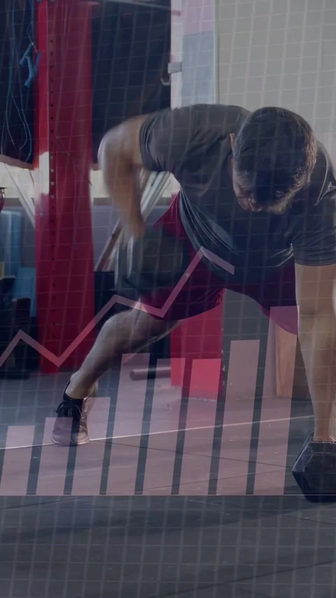 Vertical video: Man from plank grip alternating DBs rows and pushups while HUD Stock Footage 333977990