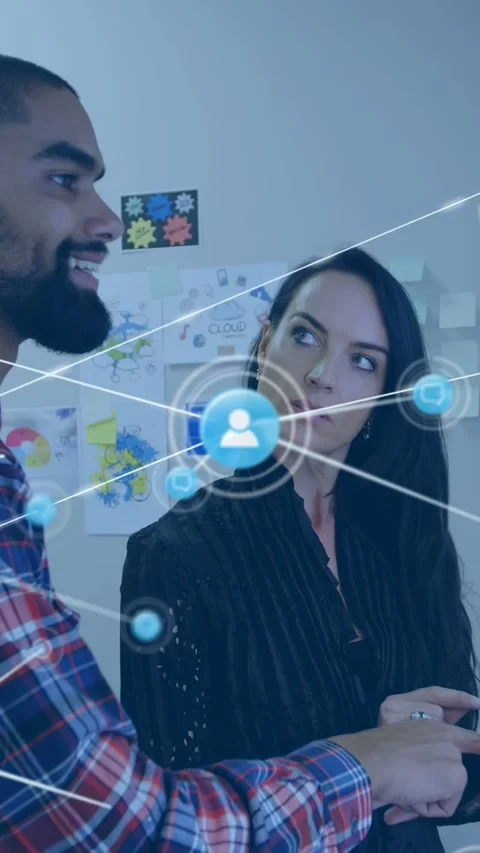 Vertical video: Man pointing device, woman tapping, 3D UI expanding into node Stock Footage 340133548