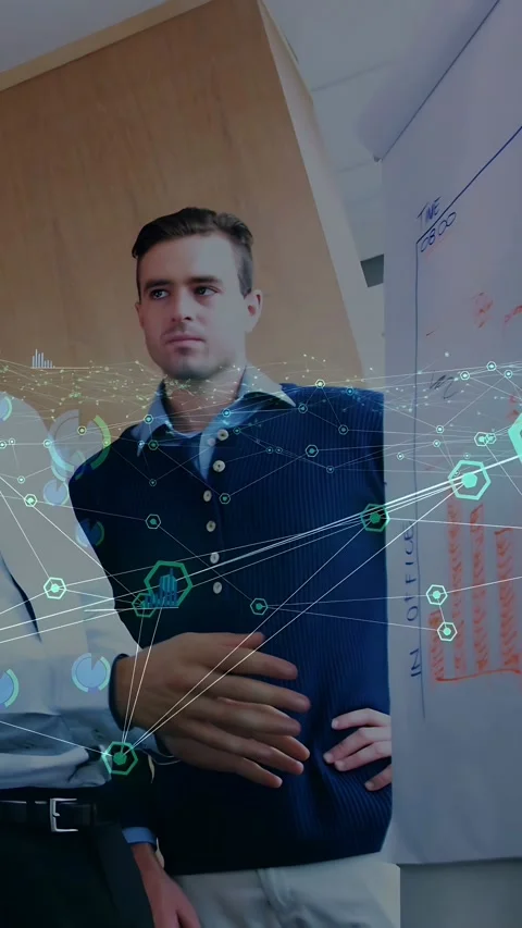 Vertical video: Man pointing flip chart and activating node overlay while peer Stock Footage 334025400