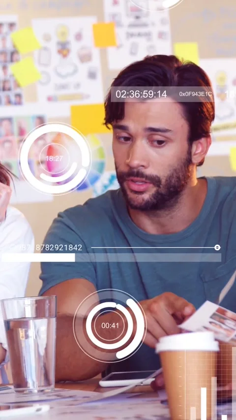 Vertical video: Man pointing prints while checking phone HUD charts expanding Stock Footage 332335122