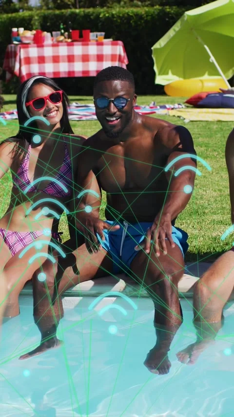 Vertical video: Man at pool edge reaching while offcamera phone starting neon Stock Footage 333744751