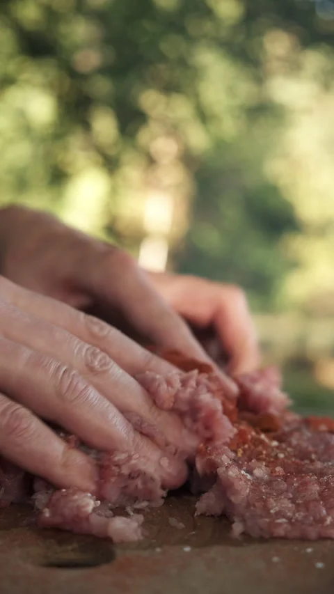 Vertical video of man prepares minced meat with hands for kebab, patties Stock Footage 286314214