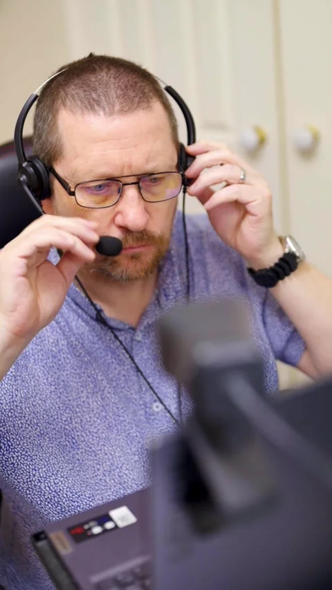 Vertical video of man preparing for online meeting Stock Footage 329358265