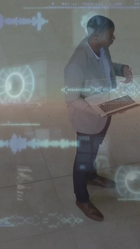 Vertical video: Man presenting on laptop to peer in business lobby starting AR Stock Footage 334540834