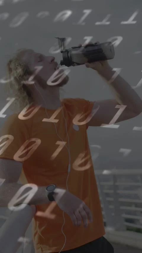 Vertical video: Man raising bottle, drinking at sea railing, binary overlaying Video stock 333821395