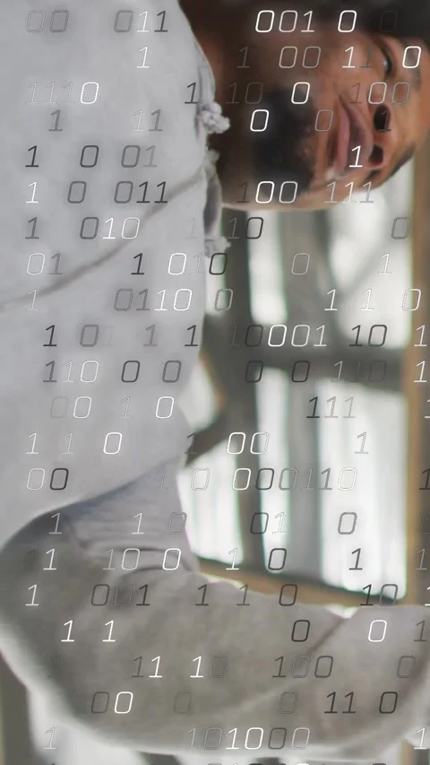 Vertical video: Man reaching headset under truss placing on head while binary Stock Footage 334187597
