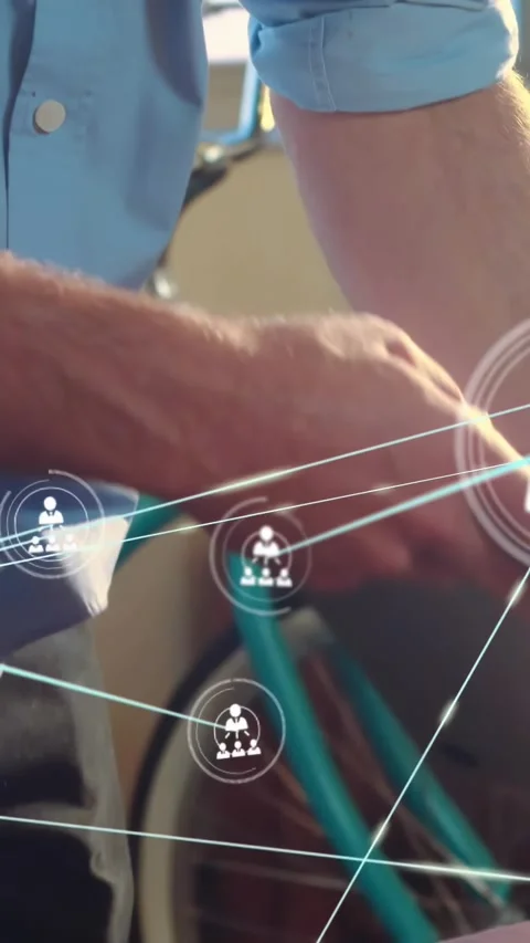 Vertical video: Man reaching for tablet activating tech overlay and analyzing Stock Footage 330260182