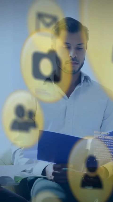 Vertical video: Man reading blue folder talking business while yellow icons Stock Footage 331181871