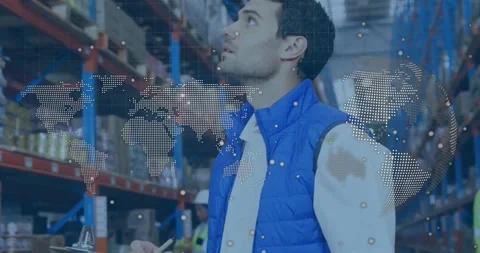 Vertical video: Man reading clipboard in depot causing map overlay, scanning Stock Footage 330622053