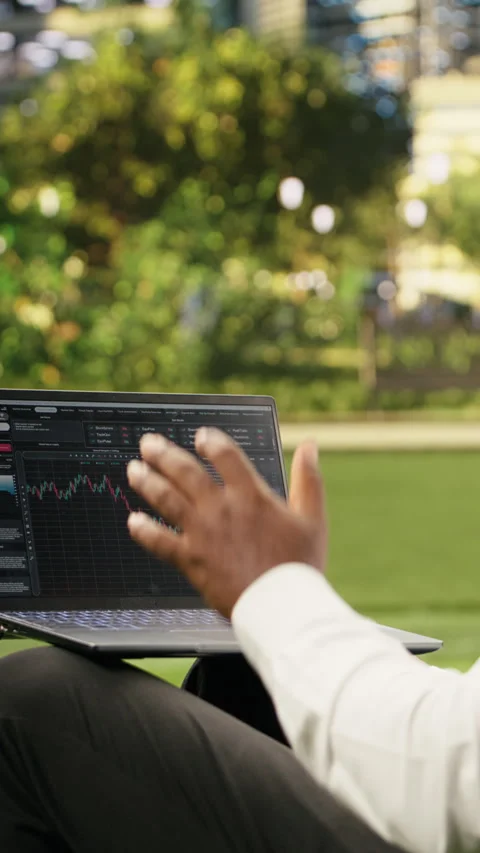 Vertical Video Man reading financial data graphs on forex web platform Video stock 344380868