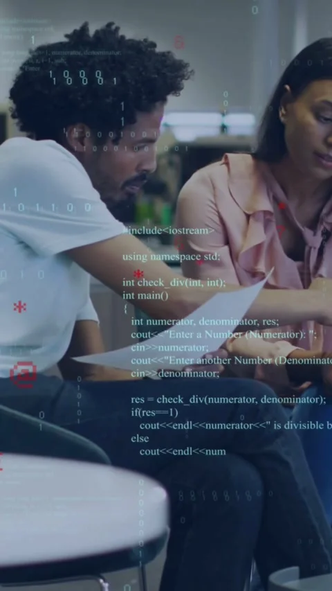 Vertical video: Man reading paper leaning pointing to woman to review code, tech Stock Footage 332278316