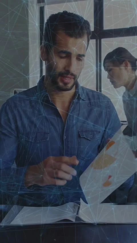 Vertical video: Man reading top sheet and causing web overlay while turning Stock Footage 329962019