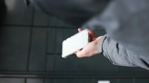 Vertical video of man receiving parcel from automatic post box using smartphone Stock Footage 266157567