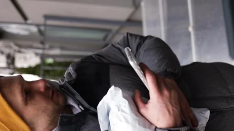 Vertical video of man receiving parcel from automatic post box using smartphone Stock Footage 266157582