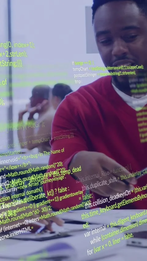 Vertical video: Man in red top handing pen, pointing at docs for tech code Stock Footage 332734779