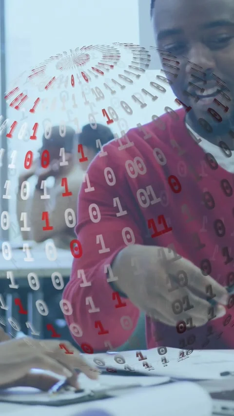 Vertical video: Man in red top handing pen, pointing papers in classroom, binary Stock Footage 334386735