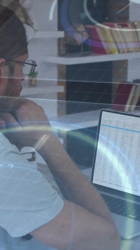 Vertical video: Man reviewing spreadsheet on laptop in finance, overlay creating Stock Footage 334390882