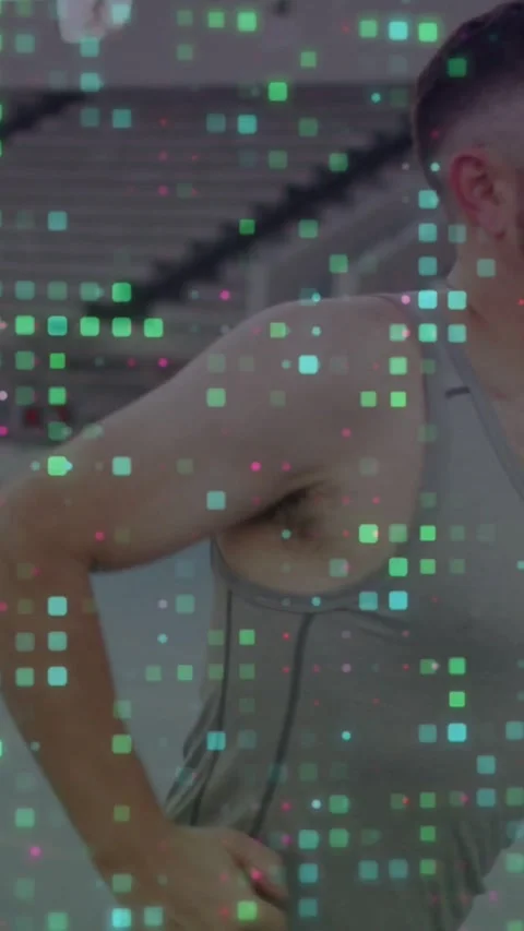 Vertical video: Man running while camera tracking in gym, pixel overlay covering Stock Footage 334550084