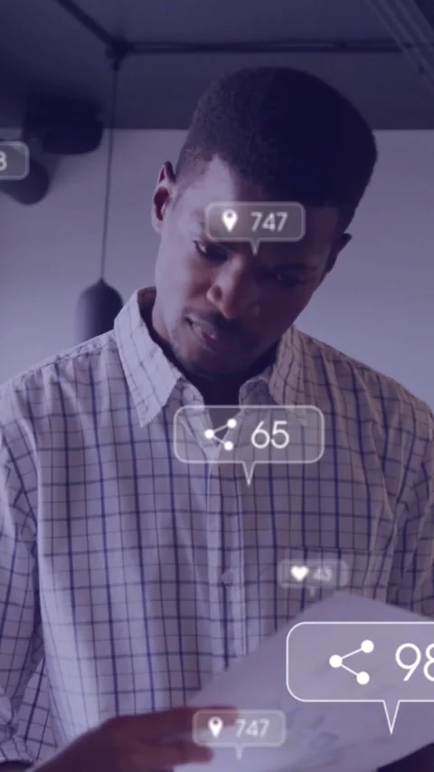 Vertical video: Man scanning doc, watching social UI counts updating and raising Stock Footage 333895667