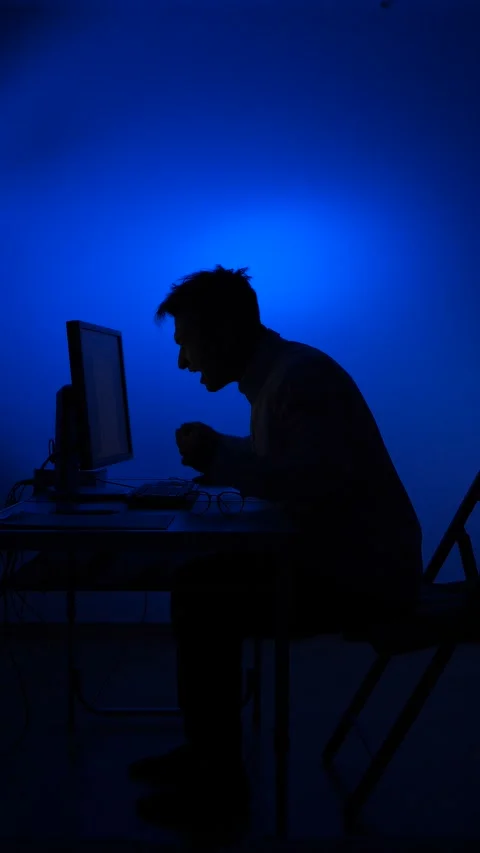 Vertical video Man screaming at computer, expressing frustration and anger Stock Footage 318982845