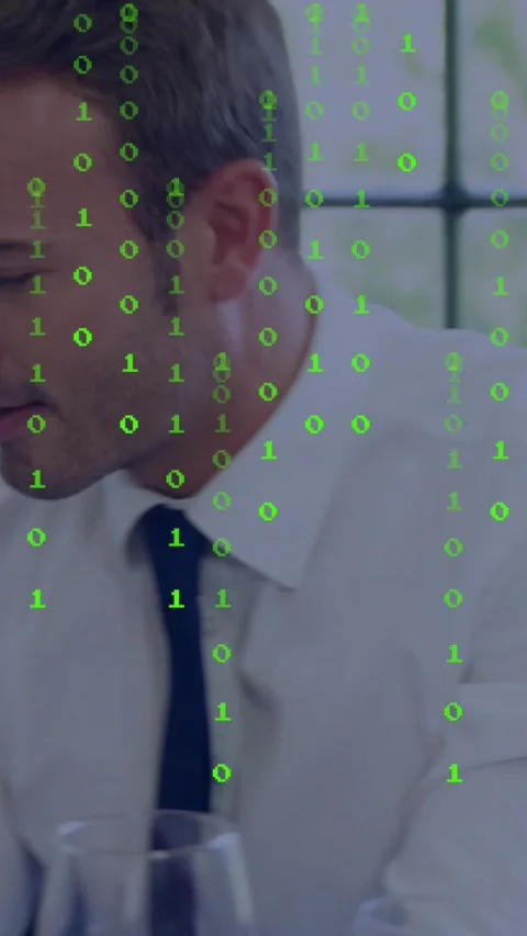 Vertical video: Man seeing device in business meeting while binary code hiding Stock Footage 334390906
