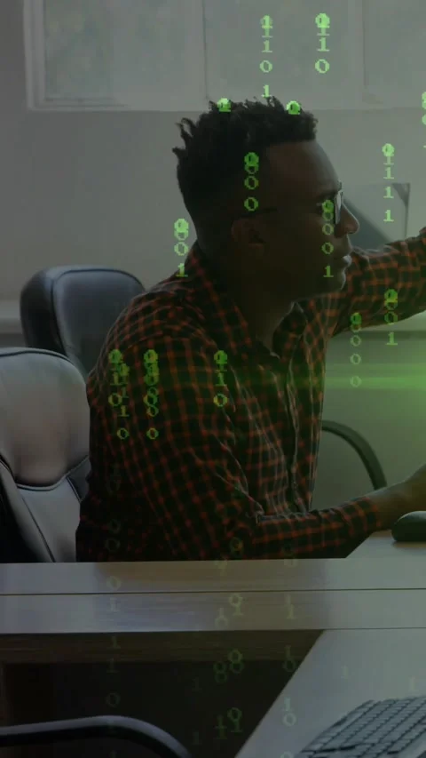 Vertical video: Man seeing tech alert, reaching and typing while green code Stock Footage 334604902