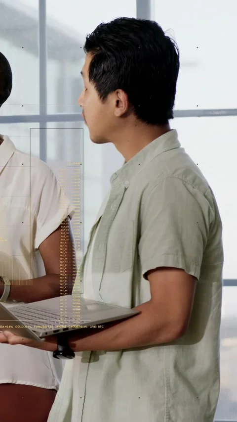 Vertical video: Man sharing data on laptop while facing woman speaking as charts Stock Footage 333596347
