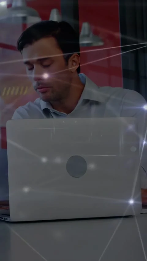 Vertical video: Man shifting after reading screen into typing at laptop, Stock Footage 334547586
