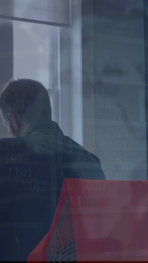 Vertical video: Man shifting, showing tech UI while team leaning at laptop Stock Footage 333603744
