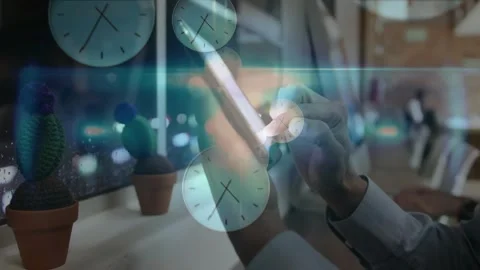 Vertical video: Man in shirt tapping tablet with stylus at desk by window, clock Stock Footage 331125539
