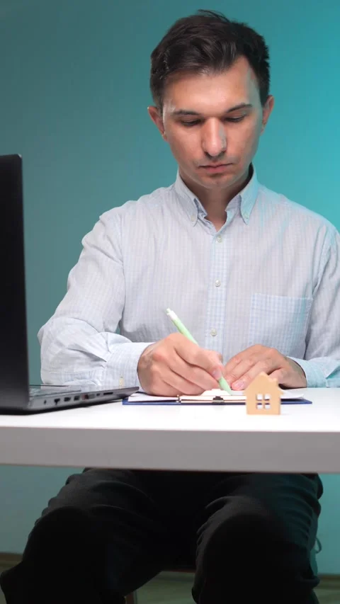 Vertical video man in shirt working on real estate contract, signing paperwork Stock Footage 342762244
