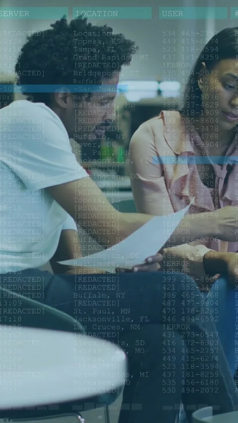 Vertical video: Man showing paper to woman, sparking code overlay over paper and Stock Footage 329913131