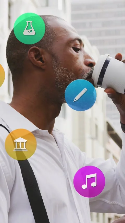 Vertical video: Man sipping mug on city street, causing tech icons orbiting him, Stock Footage 333745544