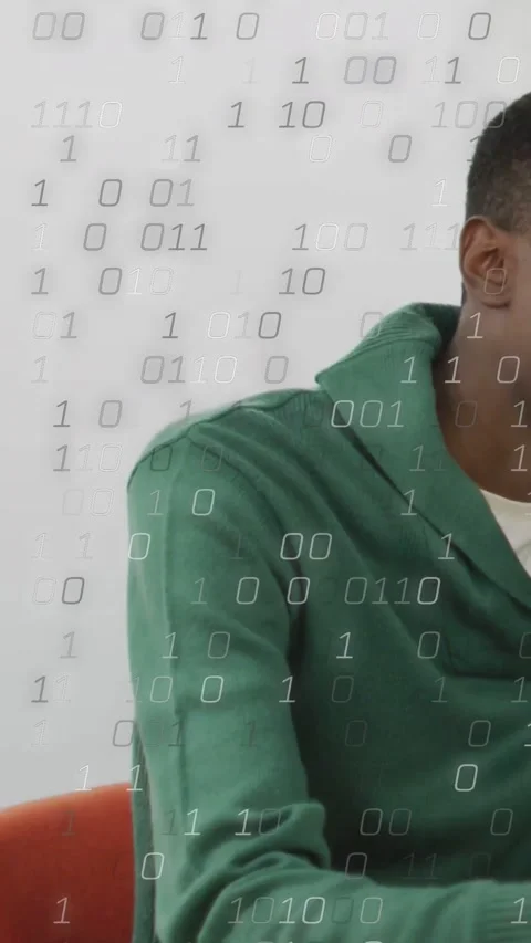 Vertical video: Man sitting and tapping device in tech demo for work, binary Stock Footage 334319417