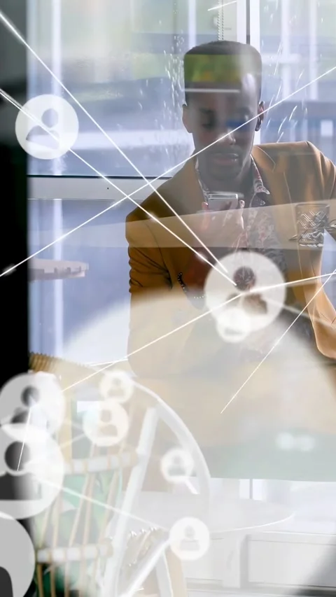 Vertical video: Man sitting in cafe tapping phone, starting overlay passing over Stock Footage 334602994