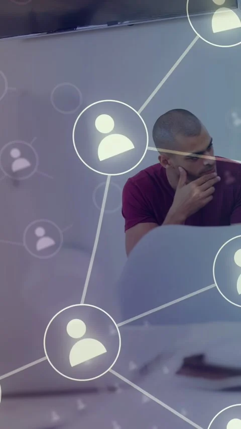 Vertical video: Man sitting chin watching icons expanding in front on click Видео 337540804