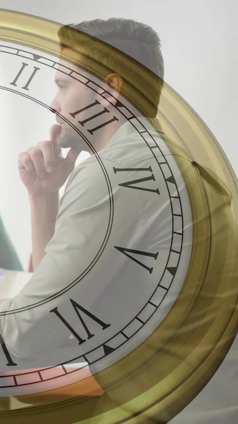 Vertical video: Man sitting at desk contemplating business task on PC while Stock Footage 332984730