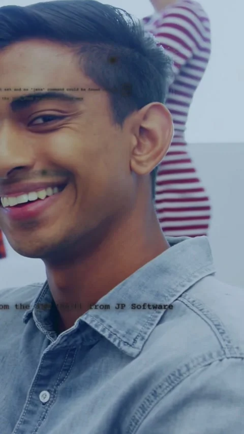 Vertical video: Man smiling and turning after colleague entering frame, code Stock Footage 331739415