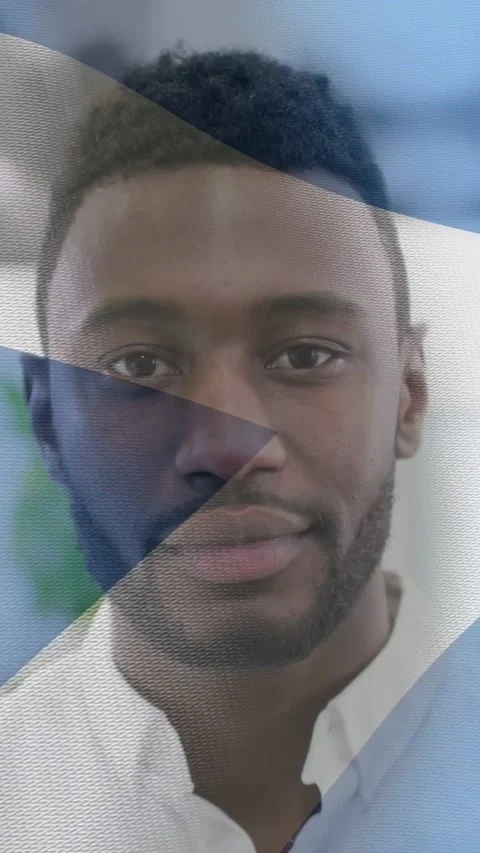Vertical video: Man smiling and nodding in room as triangle overlay sweeping Stock Footage 333496369