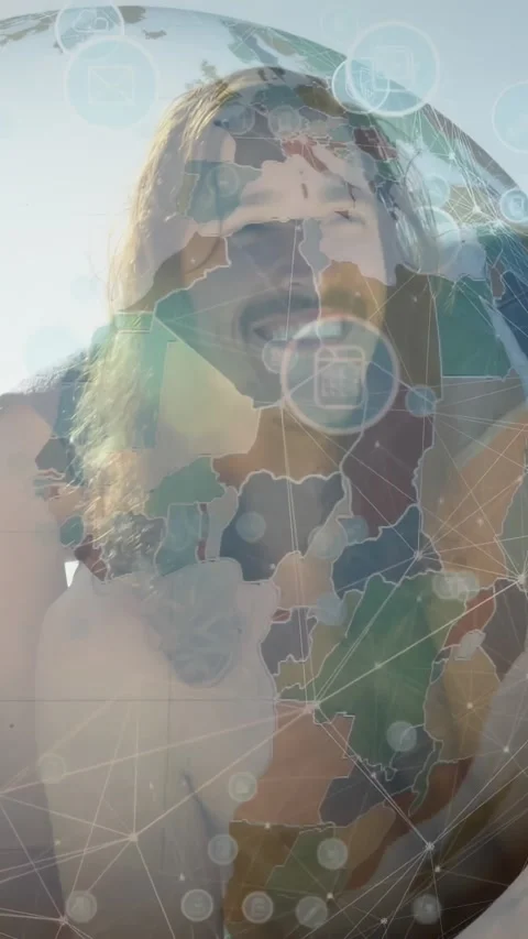 Vertical video: Man smiling on beach AR driving globe and nodes covering face Stock Footage 332278589