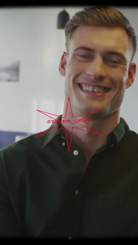 Vertical video: Man smiling, meeting gaze on camera, red star overlay anchoring Stock Footage 335513952