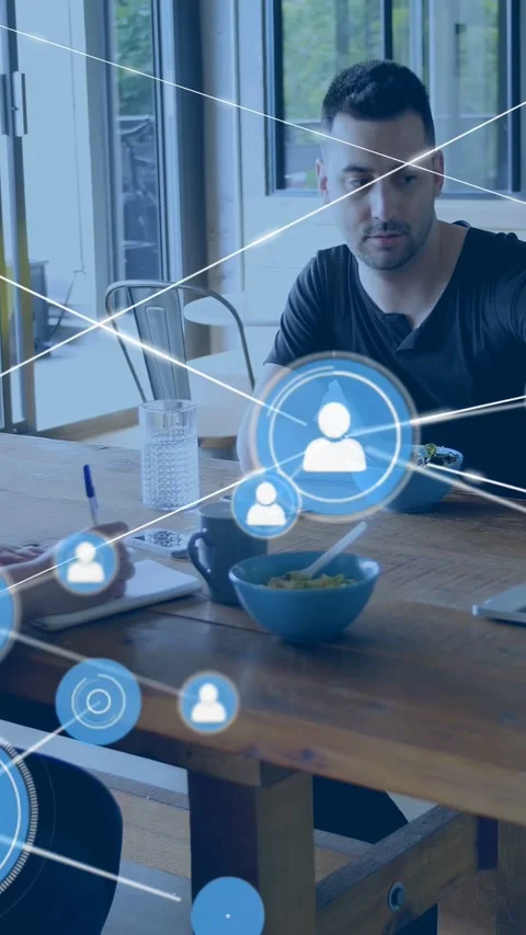 Vertical video: Man speaking at table, starting icon and expanding network over Stock Footage 333487174