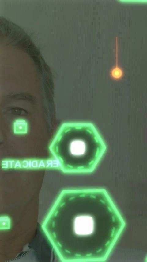 Vertical video: Man standing HUD showing hexes pulsing squares moving near face Stock Footage 333977960