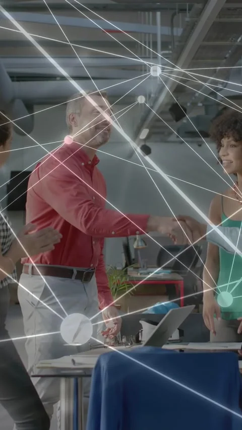 Vertical video: Man starting handshake in tech meeting, network overlay linking Stock Footage 335355264