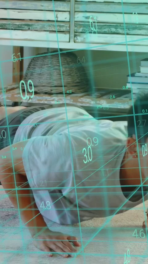 Vertical video: Man starting high-plank performing pushups at home, cyan grid Stock Footage 333487327