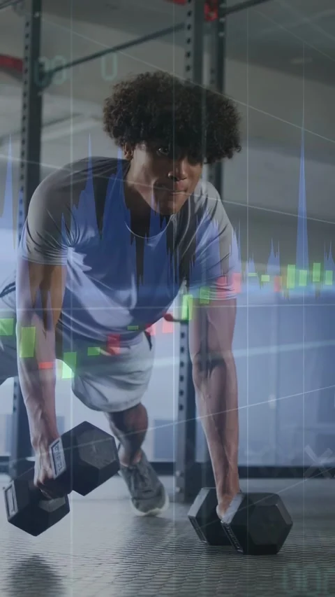 Vertical video: Man starting high plank doing dumbbell rows while waves overlay Stock Footage 337540762
