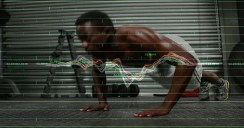 Vertical video: Man starting plank doing pushups in gym as waveform crossing Stock Footage 333965887
