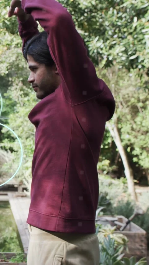 Vertical video: Man starting raising arms for health by pond while binary user Stock Footage 334025560